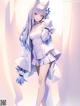 Anime girl with long blue hair wearing a white dress.